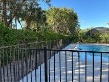 an aluminum fence providing a barrier as a pool fence in cape coral fl