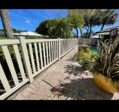 cape coral florida home with aluminum fencing around the pool
