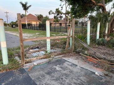 public park in cape coral with rotten damaged fence needing repaired