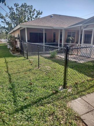 Chain link fence creating a yard space for dogs in cape coral florida