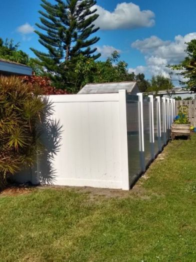 custom cape coral privacy fence with decorative landscaping