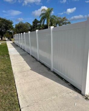 white vinyl fence along community sidewalk in cape coral fl