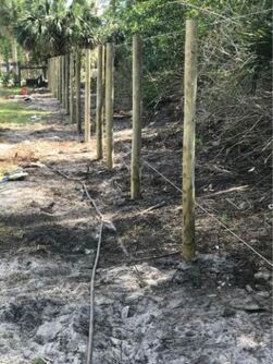 damaged fenceline being repaired in north cape coral florida