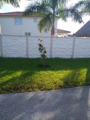 privacy fence made of white faux stone around residence in cape coral florida